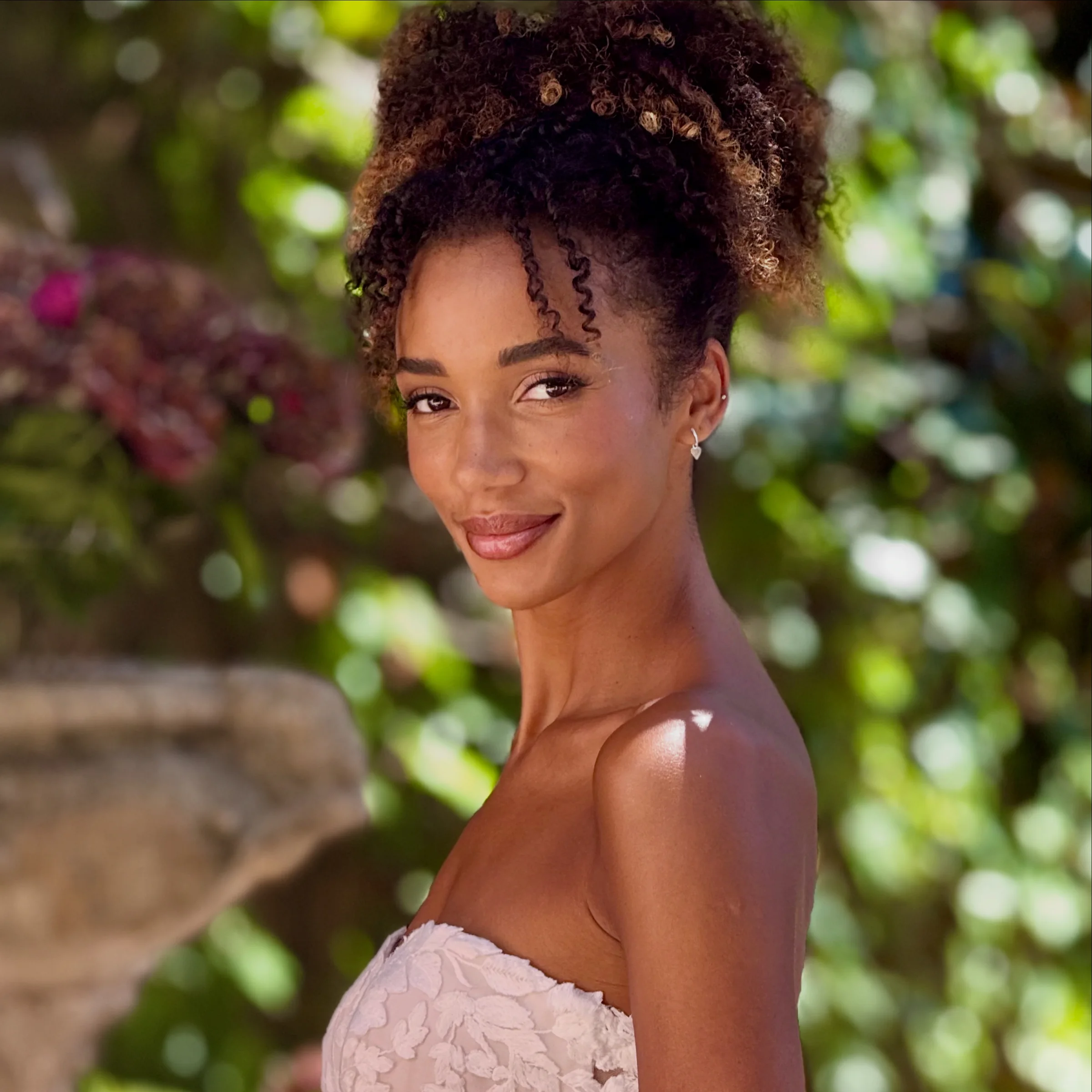 Bride in a garden destination wedding setting by Liz Patey