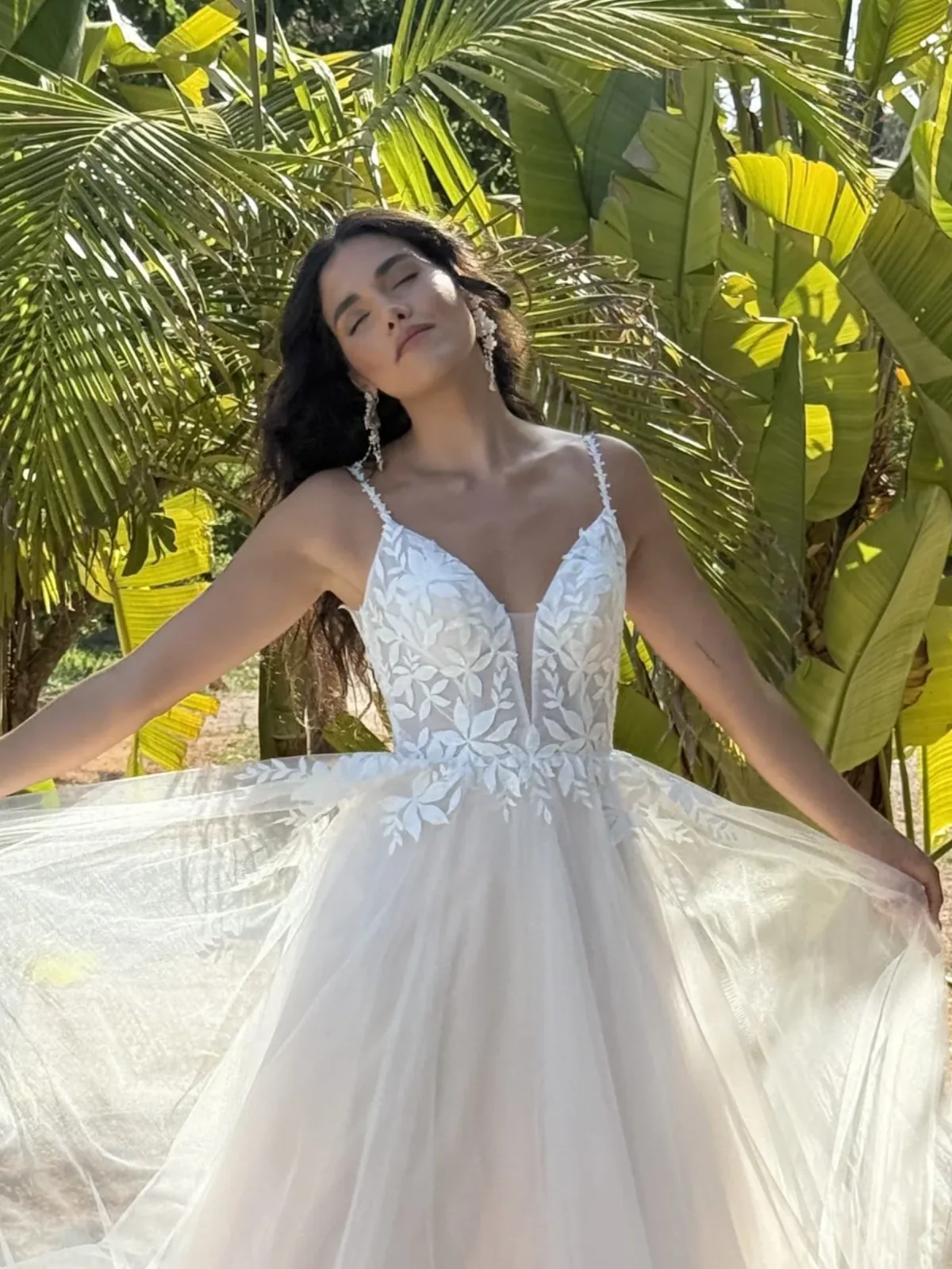 Bride in a tropical destination wedding setting by Liz Patey